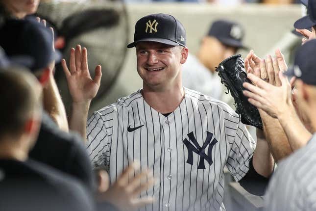Sep 6, 2023; Bronx, New York, USA;  New York Yankees starting pitcher Clarke Schmidt (36) is greeted in the dugout after being taken out in the seventh inning against the Detroit Tigers at Yankee Stadium.