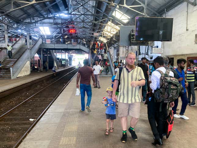 Commuters walk on a platform at the Fort railway station during a trade union strike by locomotive drivers in Colombo, Sri Lanka, Wednesday, Sept. 13, 2023. (AP Photo/Eranga Jayawardena)