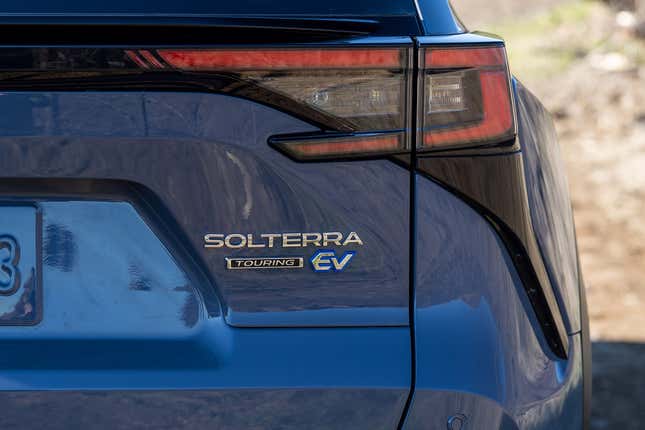 Close-up of rear badge of a blue Subaru Solterra.
