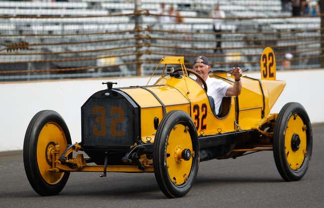 The “Marmon Wasp” winning car of the first Indianapolis 500 Mile Race is driven on the track during prerace ceremonies at Indianapolis Motor Speedway on May 29, 2011. The rearview mirror is visible just above the driver cockpit.