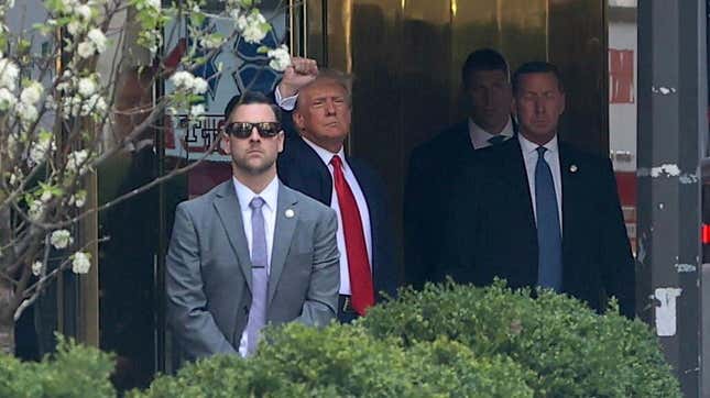 Donald Trump seen raising his fist while leaving Trump Tower