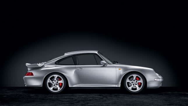 A side profile image of a silver Porsche 911 supercar. 