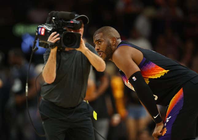 Apr 26, 2022; Phoenix, Arizona, USA; A TV cameraman records Phoenix Suns guard Chris Paul (3) against the New Orleans Pelicans during game five of the first round for the 2022 NBA playoffs at Footprint Center.