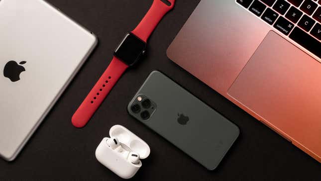 aerial view of apple ipad, watch, airpods, iphone and macbook