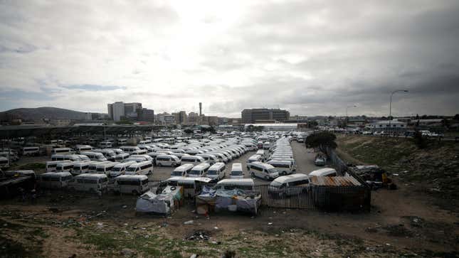 Minibus taxi's wait to load passengers at a taxi rank during a nationwide lockdown to prevent the spread of the coronavirus disease (COVID-19) in Cape Town, South Africa, May 13, 2020.