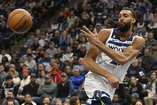 Mar 22, 2023; Minneapolis, Minnesota, USA;  Minnesota Timberwolves center Rudy Gobert (27) saves the ball from going out of bounds against the Atlanta Hawks in the second quarter at Target Center.