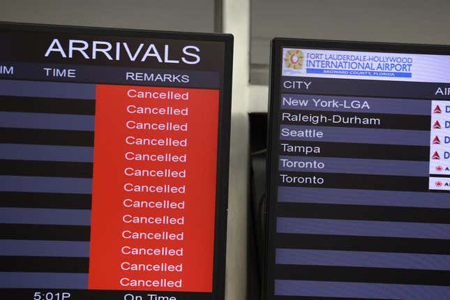 Canceled flights on the arrivals board at the Fort Lauderdale-Hollywood International Airport after it was closed due to the runways being flooded on April 13, 2023 in Fort Lauderdale, Florida. 