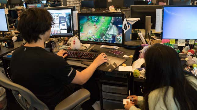 Two employees working at Riot Games