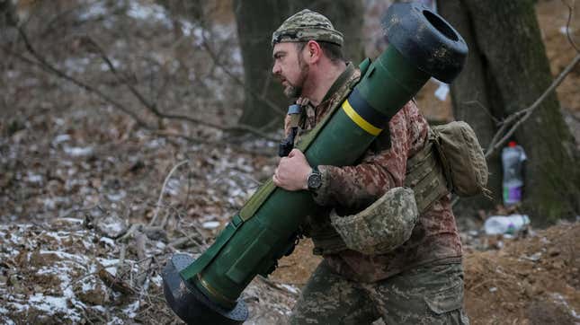A Ukrainian soldier carries a US-made Javelin anti-tank missile.