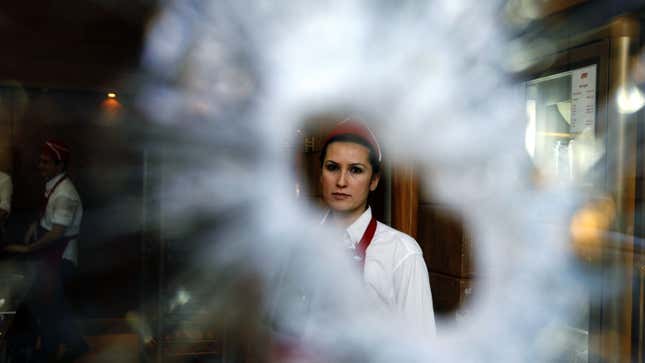 A worker is seen inside a shop damaged during recent clashes in central Beirut May 18, 2008. Rival Lebanese leaders made progress towards ending their political crisis on Sunday but disagreements over Hezbollah's weapons remained a major hurdle to a Qatari-mediated deal. REUTERS/Damir Sagolj