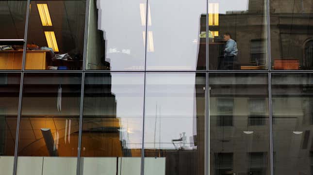 An employee sits at his desk in an office complex in Washington, U.S., August 3, 2018.