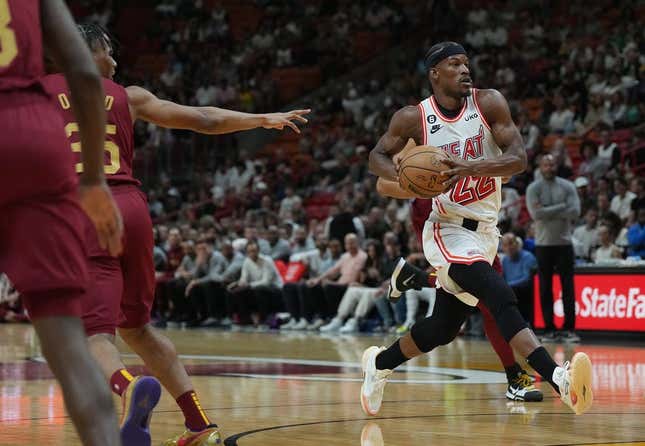 Mar 10, 2023; Miami, Florida, USA; Miami Heat forward Jimmy Butler (22) heads toward the basket as Cleveland Cavaliers forward Isaac Okoro (35) defends in the first half at Miami-Dade Arena.
