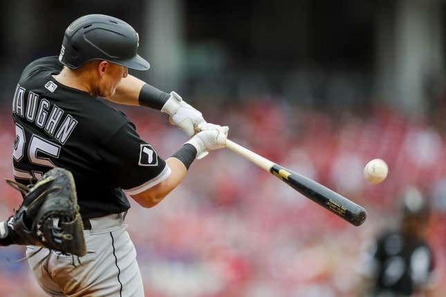 May 7, 2023; Cincinnati, Ohio, USA; Chicago White Sox first baseman Andrew Vaughn (25) hits a sacrifice fly against the Cincinnati Reds in the fifth inning at Great American Ball Park.
