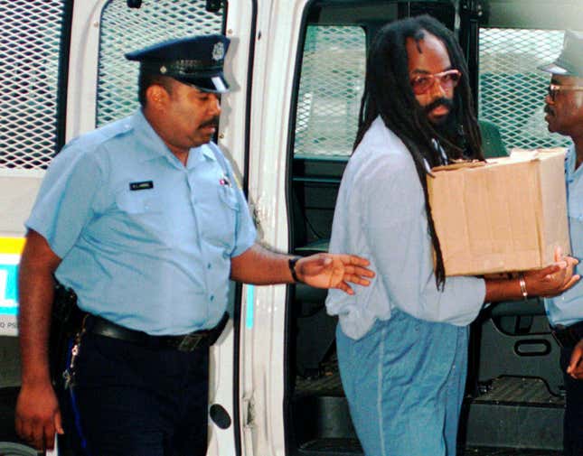 In this July 25, 1995 file photo, Mumia Abu-Jamal, convicted of killing a policeman, arrives at Philadelphia’s City Hall. Former death row inmate Abu-Jamal is back in court Thursday, Aug. 30, 2018, requesting that his failed appeals attempts be vacated, so he can once again appeal his case. The former Black Panther spent 29 years on death row following his conviction in the 1981 murder of Philadelphia police Officer Daniel Faulkner. 
