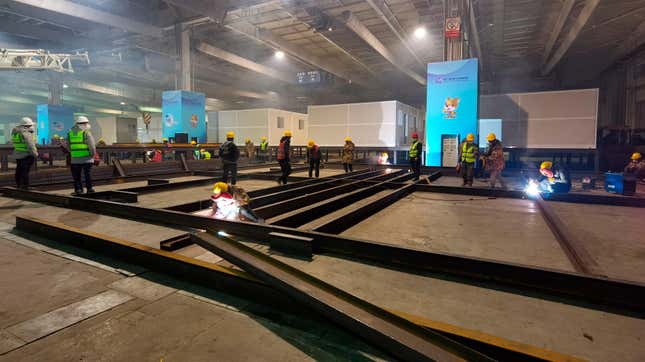 Workers build isolation wards in a temporary hospital for covid-19 patients inside an exhibition center in Changchun, China in Jilin province on March 14, 2022.
