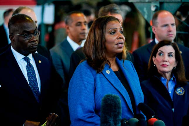 FILE - New York Attorney General Letitia James, center, accompanied by Buffalo Mayor Byron Brown, left, New York Gov. Kathy Hochul, right, and other officials, speaks with members of the media during a news conference near the scene of a shooting at a supermarket, in Buffalo, N.Y.