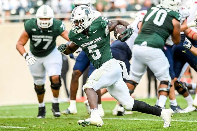 Michigan State&#39;s Nathan Carter runs for his third touchdown in the third quarter against Richmond on Saturday, Sept. 9, 2023, at Spartan Stadium in East Lansing.