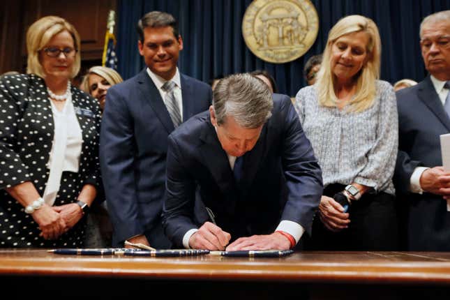 Georgia's Republican Gov. Brian Kemp, center, signs legislation in Atlanta, on May 7, 2019, banning abortions once a fetal heartbeat can be detected, which can be as early as six weeks before many women know they're pregnant. A federal appeals court on Wednesday, July 20, 2022, overturned a lower court ruling and said Georgia’s restrictive 2019 abortion law should be allowed to take effect.