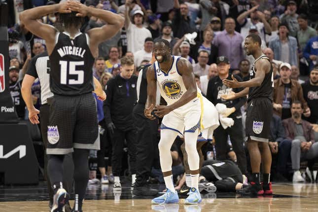 April 17, 2023; Sacramento, California, USA; Golden State Warriors forward Draymond Green (23) reacts towards the referee after a play with Sacramento Kings forward Domantas Sabonis (10) laying on the court during the fourth quarter in game two of the first round of the 2023 NBA playoffs at Golden 1 Center.