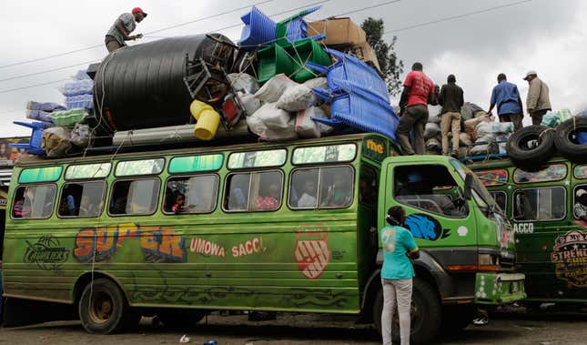 Travelers going to their rural homes wait inside minibuses as they wait for their belongings to be tied on top of the buses at one of the busy bus stations in downtown Nairobi, Kenya, 03 August 2017. For the past few days most of the bus stops in Nairobi have been busy as most Kenyans residing in the capital continue to flock them, as they travel to their upcountry homes ahead of polls to vote and some leaving the city as a security measure fearing violence might break after the elections. Kenya will hold general elections on 08 August.