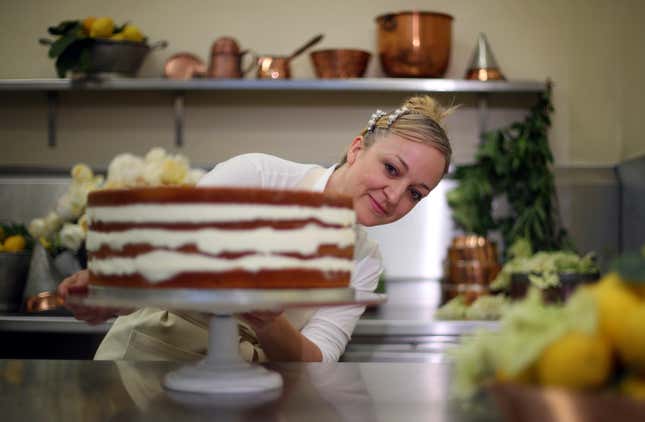 Claire Ptak frosts the royal wedding cake with elderflower buttercream.