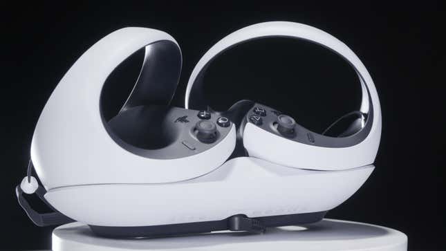 A picture of the PS VR2 controllers sees them sitting in their optional charging cradle.