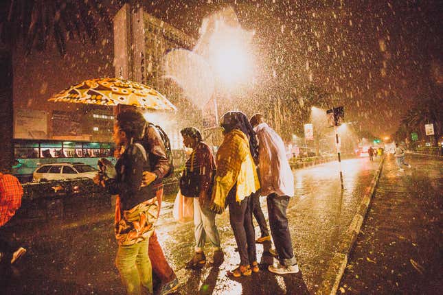 Women caught in the rain in Nairobi’s central business district.