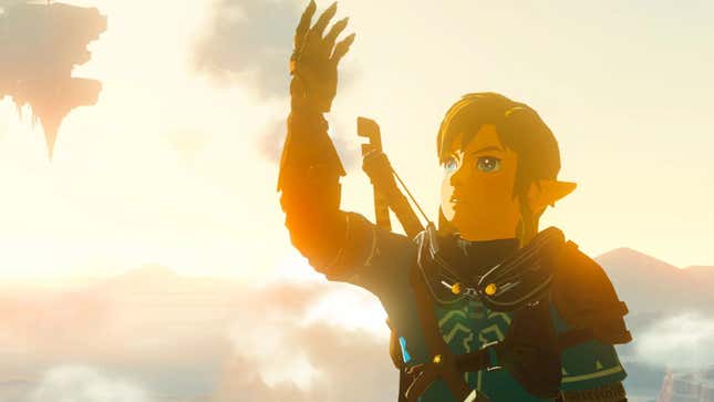 Link is shown raising his corrupted arm and looking at it inquisitively. 