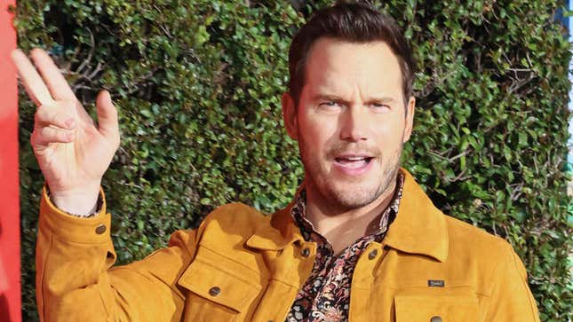 A photo shows Chris Pratt in a yellow jacket as he waves to the camera. 