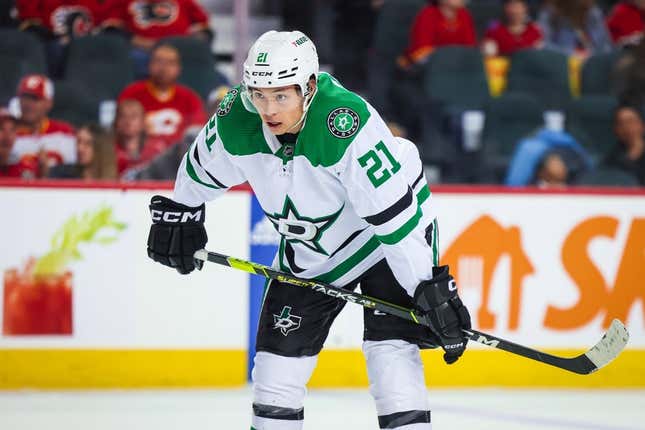Mar 18, 2023; Calgary, Alberta, CAN; Dallas Stars left wing Jason Robertson (21) against the Calgary Flames during the first period at Scotiabank Saddledome.
