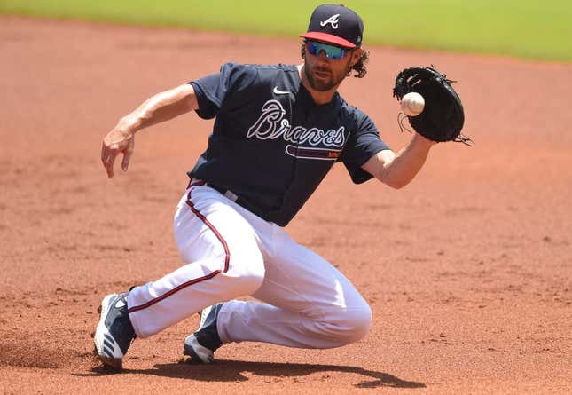 Jul 16, 2020; Atlanta, Georgia, United States; Atlanta Braves second baseman Charlie Culberson (8) fields a ground ball during an intrasquad game in their summer workout session at Truist Park.