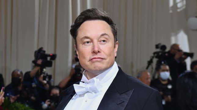 Elon Musk smirks in a tuxedo.