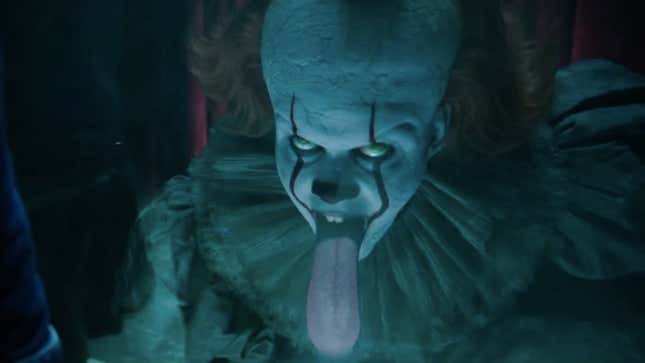 Pennywise the clown licks a glass window, horrifyingly
