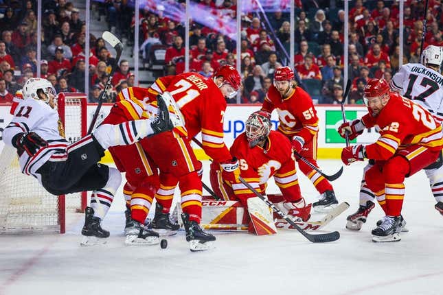 Apr 4, 2023; Calgary, Alberta, CAN; Calgary Flames goaltender Jacob Markstrom (25) makes a save against the Chicago Blackhawks during the first period at Scotiabank Saddledome.
