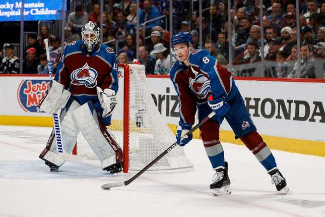 Apr 20, 2023; Denver, Colorado, USA; Colorado Avalanche defenseman Cale Makar (8) controls the puck ahead of goaltender Alexandar Georgiev (40) in the first period against the Seattle Kraken in game two of the first round of the 2023 Stanley Cup Playoffs at Ball Arena.