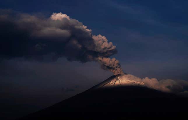The Popocatepetl volcano spews ash and steam, seen from Santiago Xalitzintla, Mexico on May 24, 2023.