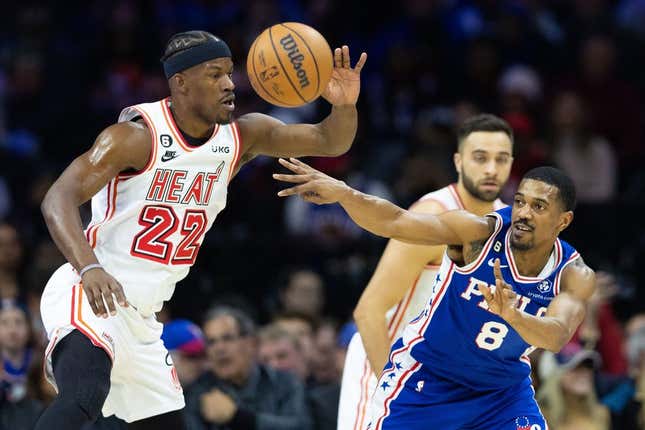 Feb 27, 2023; Philadelphia, Pennsylvania, USA; Philadelphia 76ers guard De'Anthony Melton (8) passes the ball past Miami Heat forward Jimmy Butler (22) during the first quarter at Wells Fargo Center.