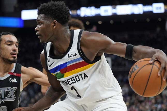 Apr 8, 2023; Austin, Texas, USA; Minnesota Timberwolves guard Anthony Edwards (1) drives to the basket while defended by San Antonio Spurs guard Tre Jones (33) during the second half at Moody Center.