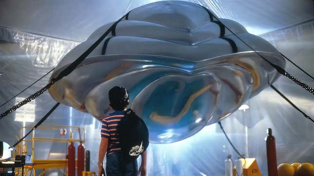A boy stairs at a spaceship in a still from the 1986 film Flight of the Navigator.