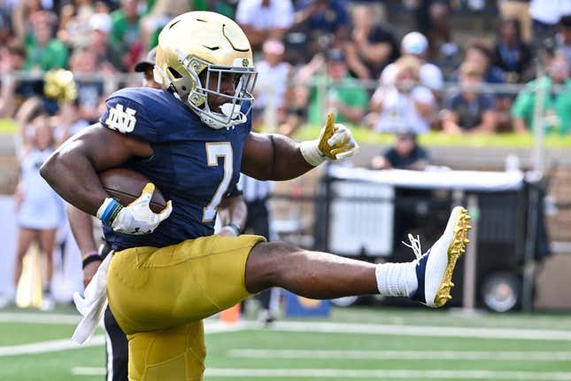 Sep 2, 2023; South Bend, Indiana, USA; Notre Dame Fighting Irish running back Audric Estime (7) scores in the second quarter against the Tennessee State Tigers at Notre Dame Stadium.