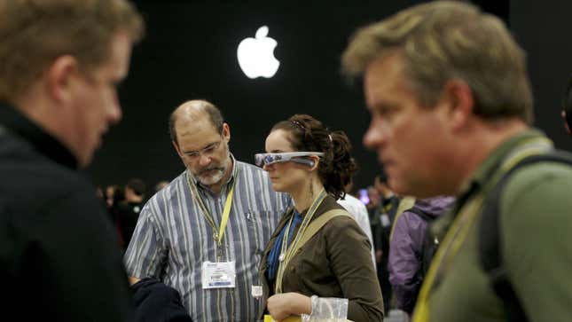 A picture of people trying AR glasses at an Apple event