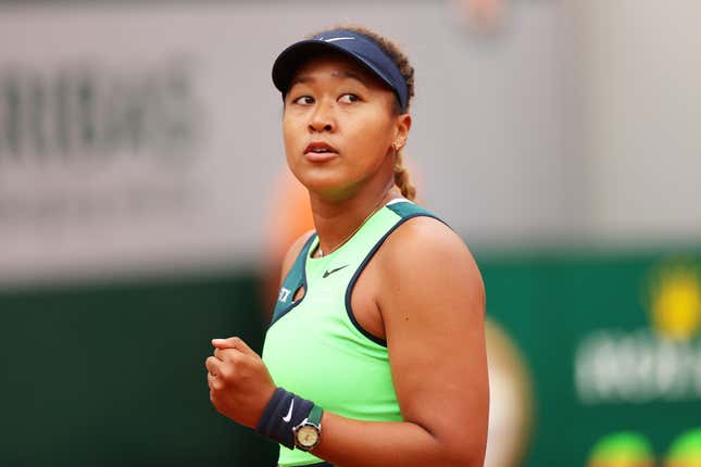 Naomi Osaka of Japan celebrates against Amanda Anisimova of USA during the Women’s Singles First Round match on Day 2 of The 2022 French Open at Roland Garros on May 23, 2022 in Paris, France. (Photo by Ryan Pierse/Getty Images)