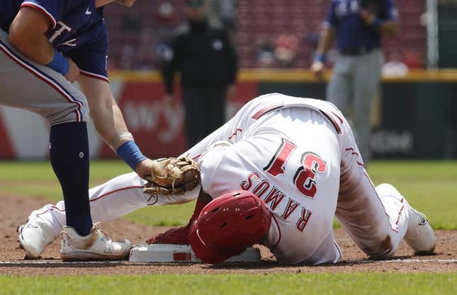 Apr 26, 2023; Cincinnati, Ohio, USA; Cincinnati Reds right fielder Henry Ramos (31) slides safely into third base for an RBI triple against the Texas Rangers during the second inning at Great American Ball Park.