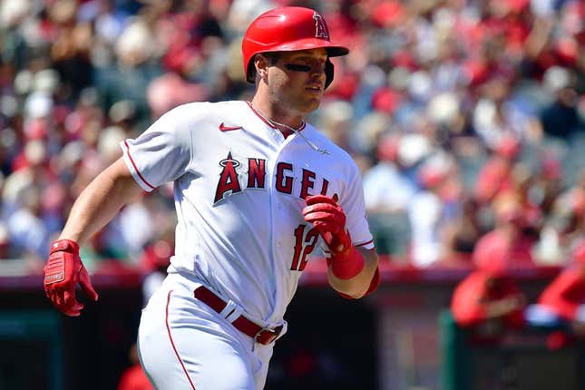 Apr 9, 2023; Anaheim, California, USA; Los Angeles Angels right fielder Hunter Renfroe (12) reaches first on a single against the Toronto Blue Jays during the third inning at Angel Stadium.