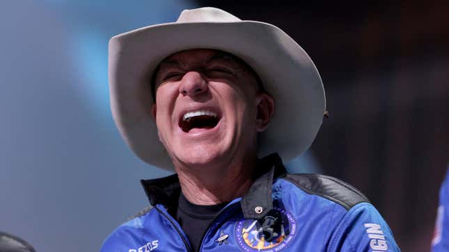 Amazon founder Jeff Bezos laughs as he speaks about his flight on Blue Origin’s New Shepard during a press conference on July 20, 2021 in Van Horn, Texas.
