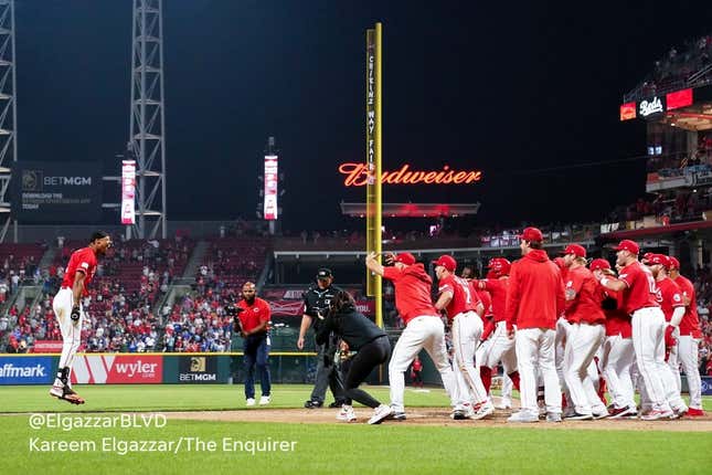 Cincinnati Reds left fielder Will Benson (30) is congratulated at home plate after hitting a walk-off, two-run home run in the ninth inning of a baseball game between the Los Angeles Dodgers and the Cincinnati Reds, Wednesday, June 7, 2023, at Great American Ball Park in Cincinnati.