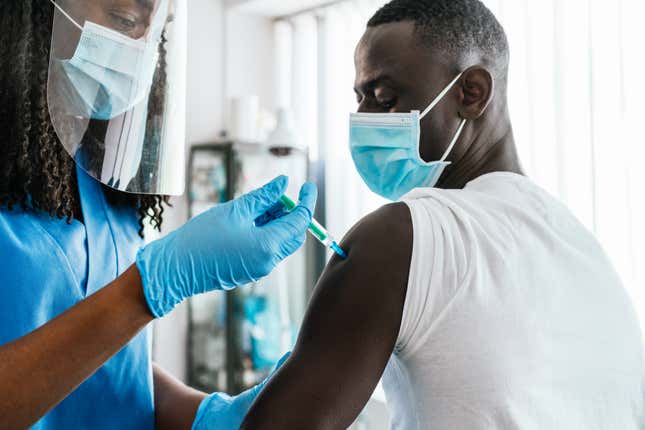 Black man getting vaccinated 
