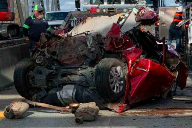 Image for article titled Nissan Altima Driver Survives Absurd Crash After Her Car Literally Folds Onto Itself Under A Big Rig