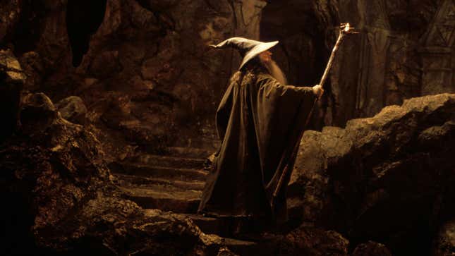 Gandalf gestures with his wizard staff in a scene from Peter Jackson's Lord of the Rings.