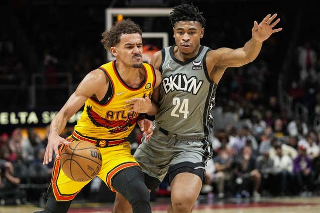 Apr 2, 2022; Atlanta, Georgia, USA; Atlanta Hawks guard Trae Young (11) is guarded by Brooklyn Nets guard Cam Thomas (24) during the second half at State Farm Arena.